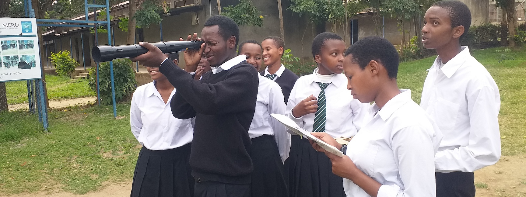 Students use a new Galileoscope telescope at Makumira school, Meru District, Tanzania
